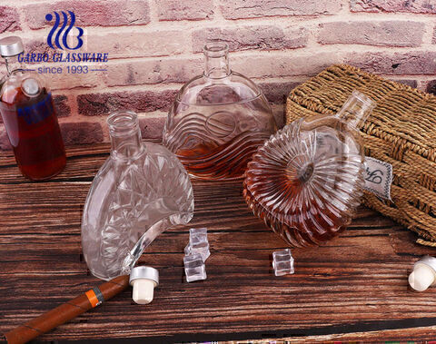 China Unique shape clear whiskey decanter with pattern 500ml glass bottles for wine factory