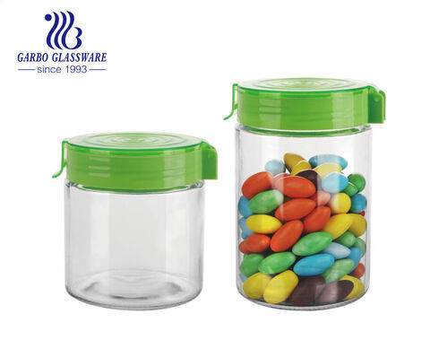 Machine-made 900ml glass cookie peanut storage jar with customized design colored leak-proof plastic lid Factory